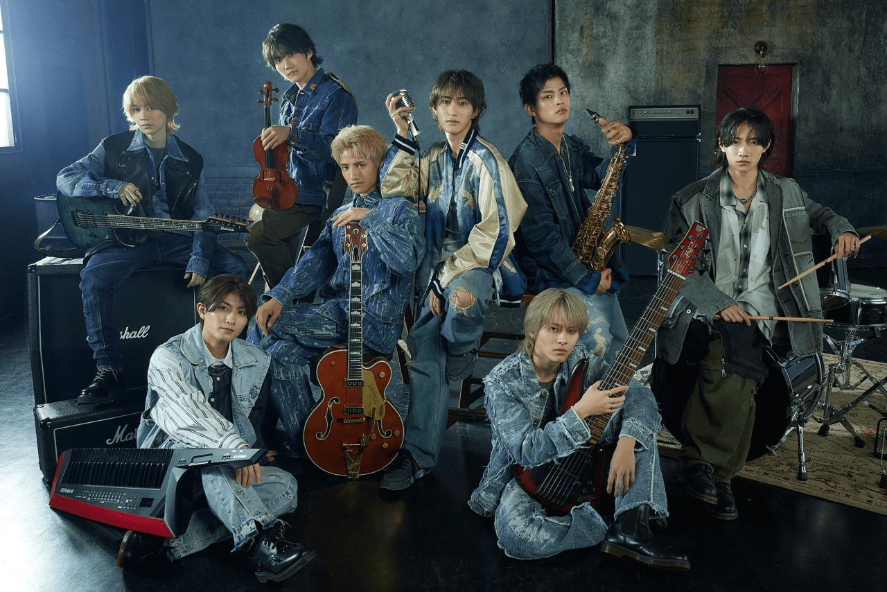 The junior group B&ZAI poses together in a stylish setting, showcasing their instruments and unique fashion, capturing the essence of their musical identity.