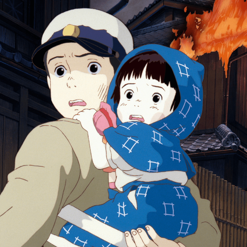 A scene from the animated film 'Grave of the Fireflies,' featuring a young boy holding his frightened sister amidst a backdrop of flames and chaos.