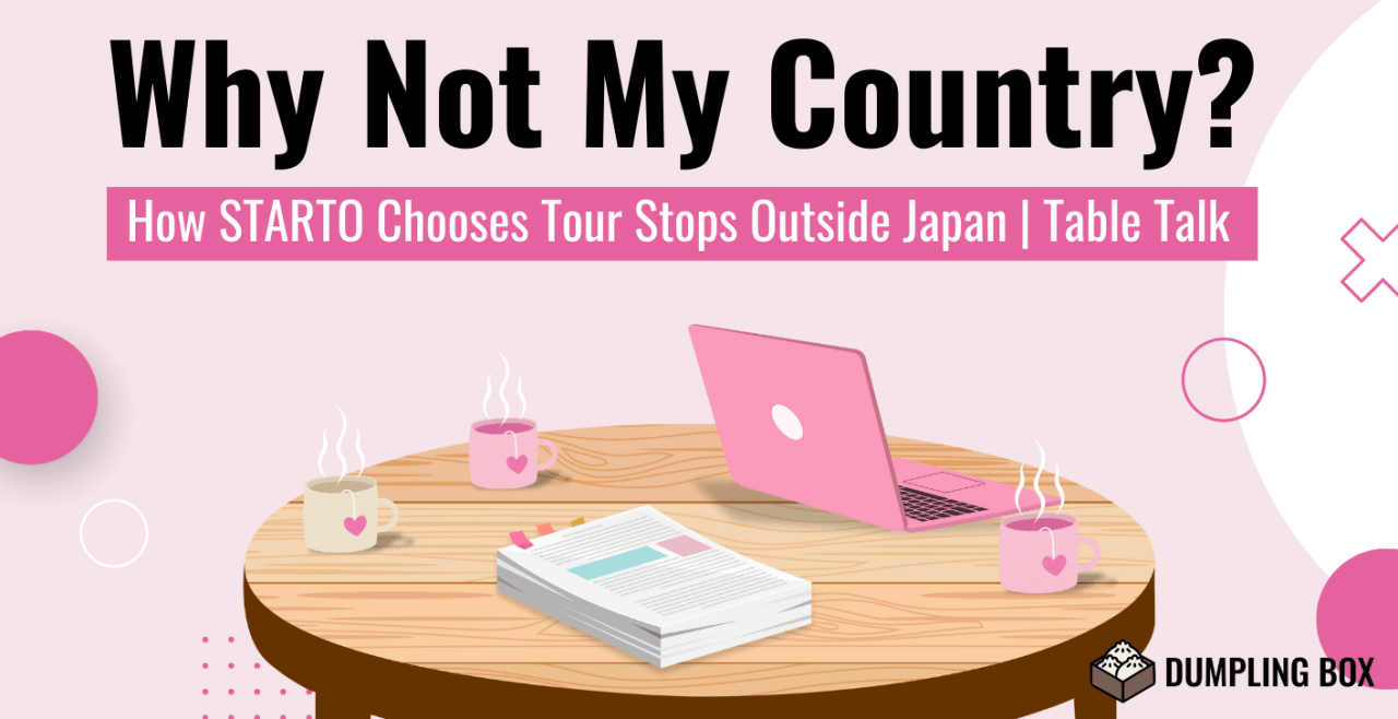 A graphic featuring a pink background with the title 'Why Not My Country? How STARTO Chooses Tour Stops Outside Japan | Table Talk'. The image includes a round wooden table with a laptop, a stack of papers, and two cups of steaming drinks.