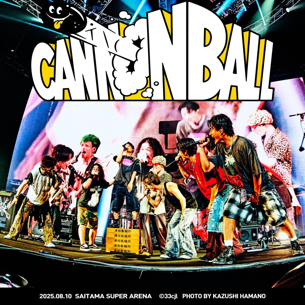 A group of six male performers energetically performing on stage at the CANNONBALL festival, with a large banner displaying the festival name in the background.