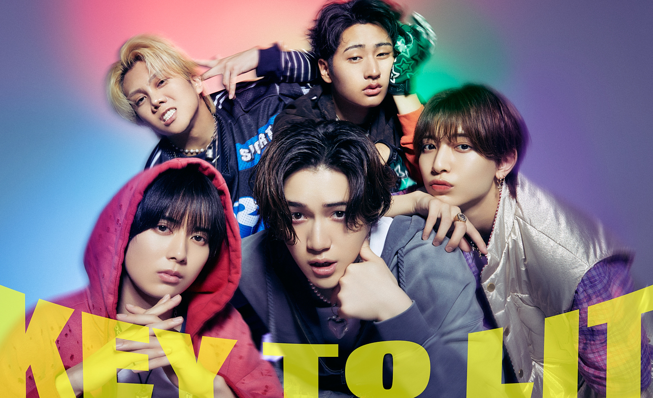 Group photo of the idol group KEY TO LIT, featuring five members posing with dynamic expressions against a colorful background.