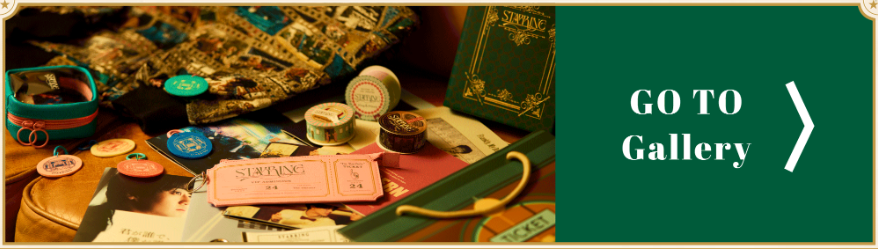 A collection of exclusive merchandise and promotional materials from the 'STARRING' Pop-Up Store, featuring colorful tokens, clothing items, and a themed book, all displayed on a wooden surface.