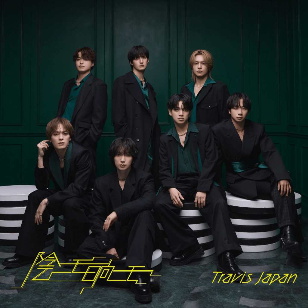 A seven-member male vocal group posing in stylish black outfits with green accents against a deep green background.